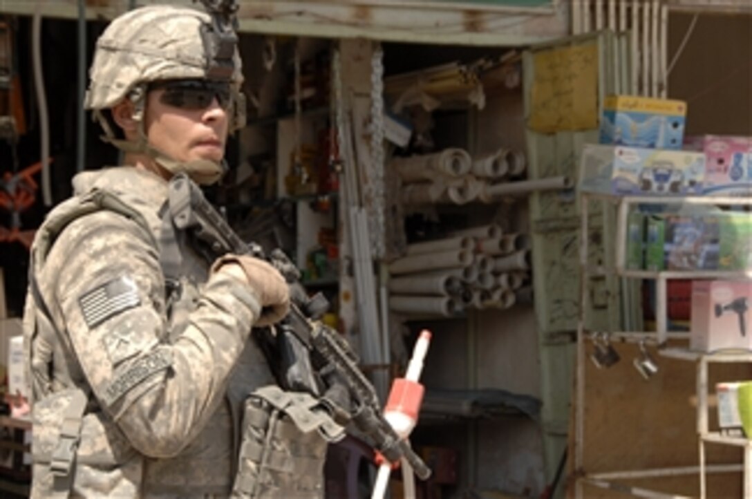 U.S. Army Pvt. 2nd Class David Morrison provides security while on patrol at a market in Khadra, Iraq, on May 4, 2008.  Morrison is in 1st Platoon, Alpha Troop, 4th Squadron, 10th Cavalry Regiment, 4th Infantry Division.  