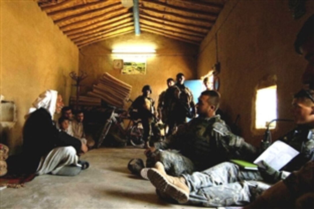 U.S. and Iraqi soldiers meet with Dhíyae, Iraq, residents to gather information and build rapport, May 4, 2008. The U.S. soldiers are assigned to the 10th Mountain Division, 222nd Battalion, Company C. 