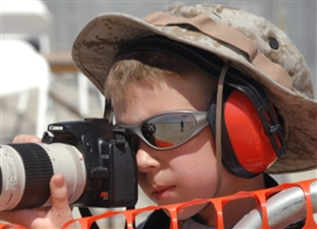 Daniel Thow, 9, photographs the U.S. Air Force Thunderbirds at AirFest 2008 at March Air Reserve Base, Calif., May 2, 2008. Daniel has been a photographer since he was 6, but has been going to air shows with his father John since he was 4. 