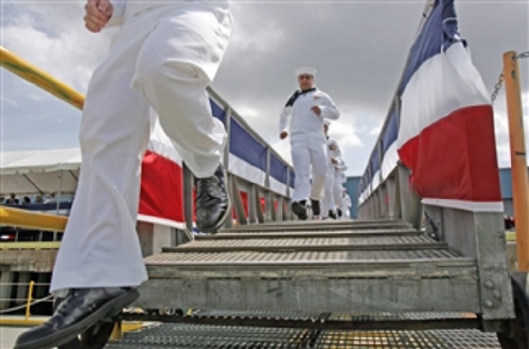 U.S. Navy sailors "man the ship" and officially bring the newest Virginia-class nuclear attack submarine USS North Carolina (SSN 777) to life during her commissioning ceremony in Wilmington, N.C., on May 3, 2008.  The North Carolina is the fourth Virginia-class submarine to be commissioned and the first major U.S. Navy combatant vessel class designed with the post-Cold War security environment in mind. North Carolina will be home ported in Groton, Conn., as a member of the U.S. Atlantic Fleet.  