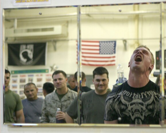 Lance Cpl. Nick Story, an infantryman with Headquarters and Service Company, 2nd Battalion, 2nd Marine Regiment, Regimental Combat Team 5, fights to dead-lift 425 pounds at the Marine Welfare and Recreation Centerâ??s superman competition here May 8. Story came in 3rd place out of 25 contestants.