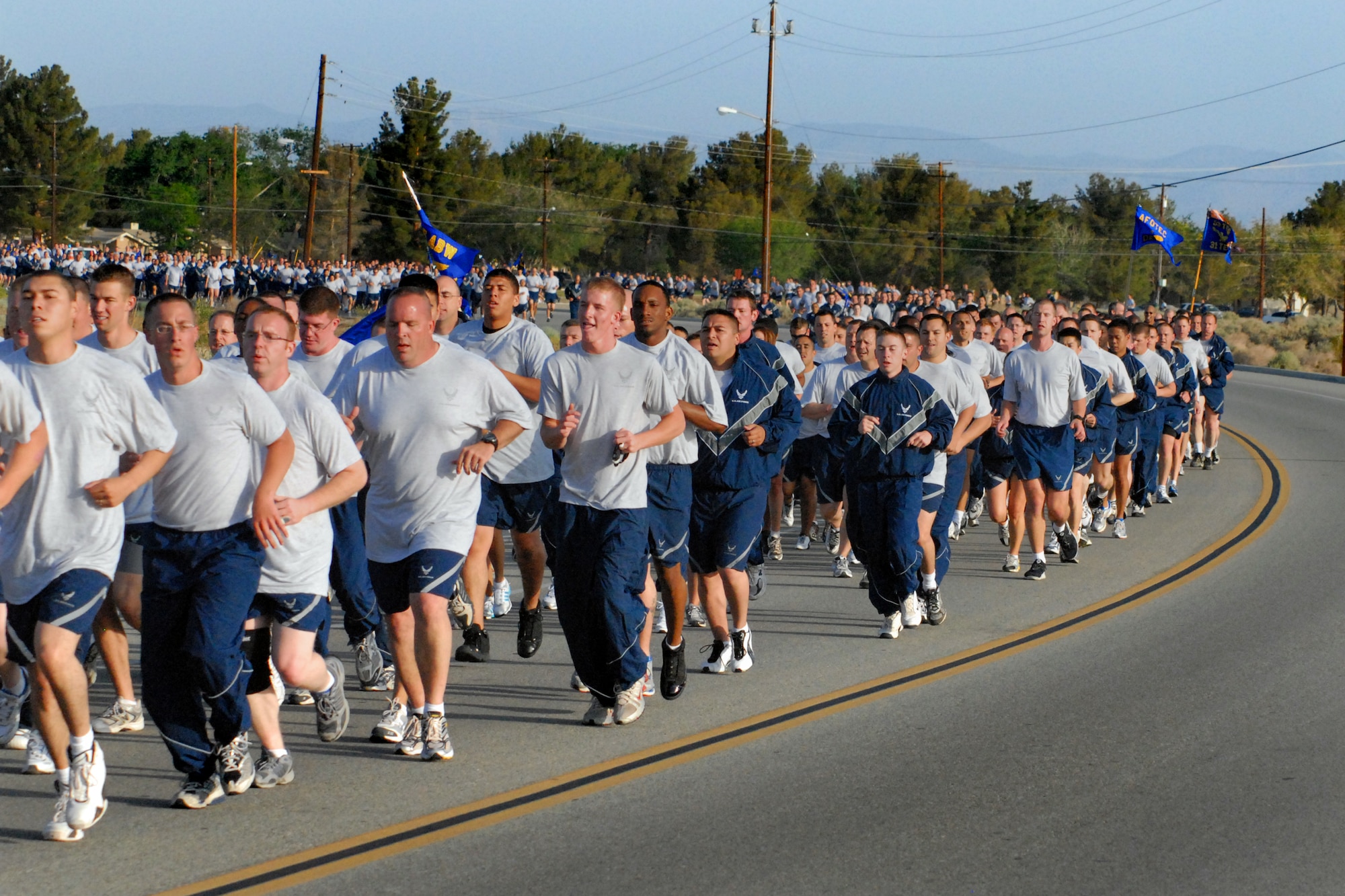 EDWARDS AIR FORCE BASE, Calif. -- Airmen from the 95th Air Base Wing run during an installation fitness run here May 9. More than 700 Airmen from the Air Force Flight Test Center participated in the 1.5-mile fitness run to promote fitness and esprit de corps. (Air Force photo by Master Sgt. Eric M. Grill)
