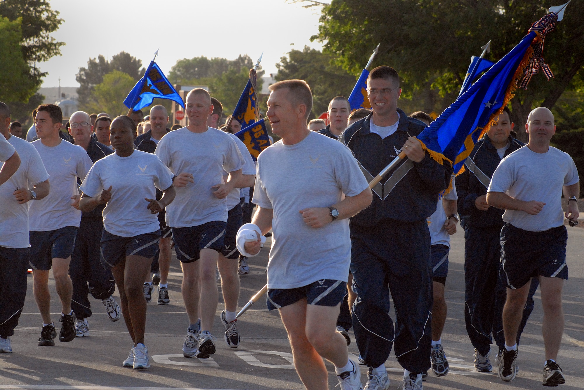 EDWARDS AIR FORCE BASE, Calif. -- Col. Rufus Edge, Individual Mobilization Augmentee to the 95th Mission Support Group commander, leads Airmen from the 95th Air Base on a 1.5-mile fitness run here May 9. More than 700 Airmen from the Air Force Flight Test Center participated in the installation fitness run to promote fitness and esprit de corps. (Air Force photo by Master Sgt. Eric M. Grill)
