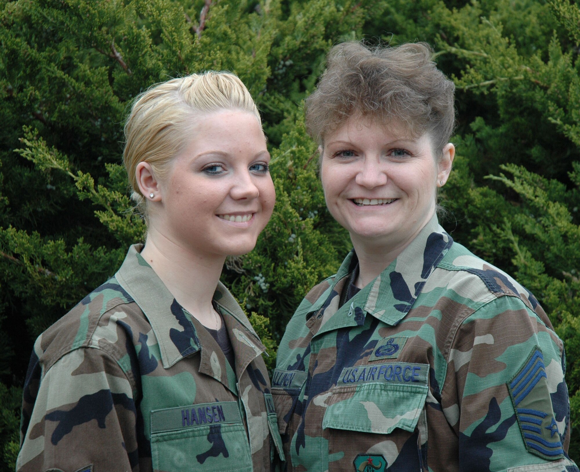 Airman First Class Kristina Hansen, left, and Chief Master Sgt. Janice Kallinen, are all smiles as one of several mother-child teams in the 446th Airlfit Wing, McChord Air Force Base, Wash.  Airman Hansen is a medical technican with the 446th Aerospace Medical Squadron.  The Chief is the chief of military personnel flight, 446th Mission Support Squadron. (U.S. Air Force photo/2nd Lt. Candice Allen)