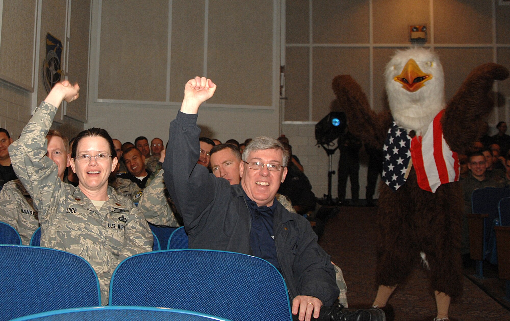 Two enthusiastic supporters show their spirit while an approving eagle encourages others to "shout it out" during the opening ceremony May 8 for Guardian Challenge 2008, Air Force Space Command's space warfighter competition. (U.S. Air Force photo/Tech. Sgt. Matthew Lohr)