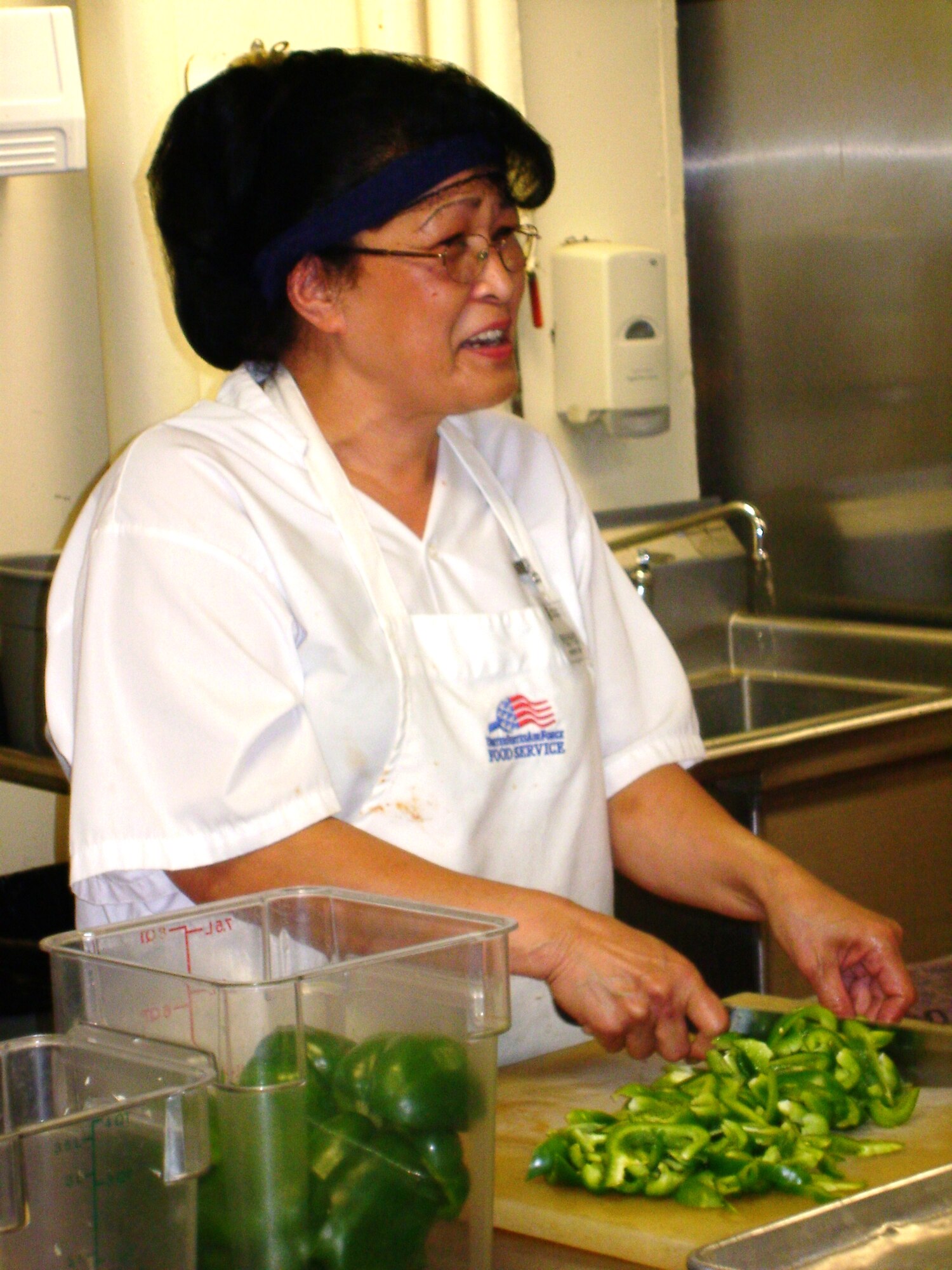 ANDREWS AIR FORCE BASE, Md. -- Bernice Sullivan, 1st Cook at the Liberty Hall Dining Facility here, chops green peppers in preparation for lunch service May 4. The dining facility is scheduled for closure May 30. (U.S. Air Force photo/Tech. Sgt. Eric Sharman)