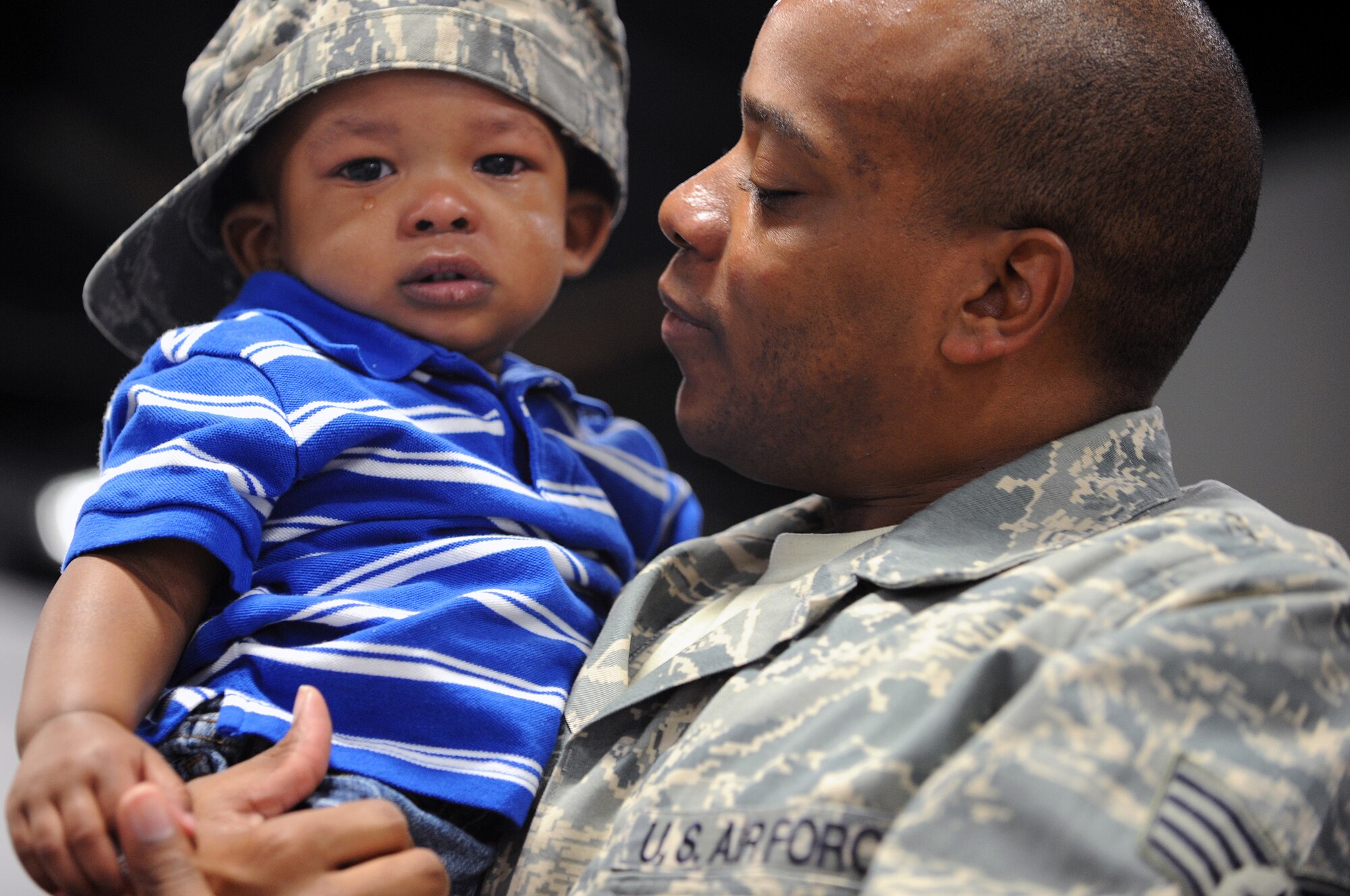 Staff Sgt. James Thomason, 28th Logistics Readiness Squadron supply supervisor, spends time with his 1-year-old son, Jayden, before leaving for a deployment here, May 9. Ten members of the 28 LRS deployed to the 379th Air Expeditionary Wing in Southwest Asia in support of Operation Iraqi Freedom and Operation Enduring Freedom. (U.S. Air Force photo/Senior Airman Marc I. Lane)