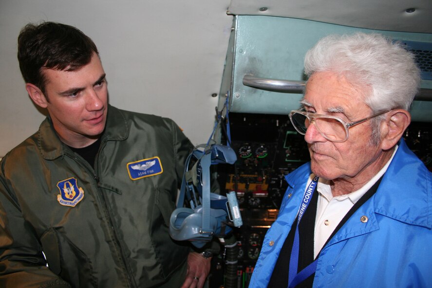 WRIGHT-PATTERSON AFB, Ohio - Capt. Adam Fink, 89th Airlift Squadron, talks with Mr. Andrew Winter, Jr., a member of the 91st Strategic Reconnaissance Wing Association during a tour of the 445th Airlift Wing and C-5 Galaxy. Association members, which include former pilots, maintainers, and crewmembers, had their annual reunion over the weekend. (U.S. Air Force photo/ Maj. David Borchardt)  