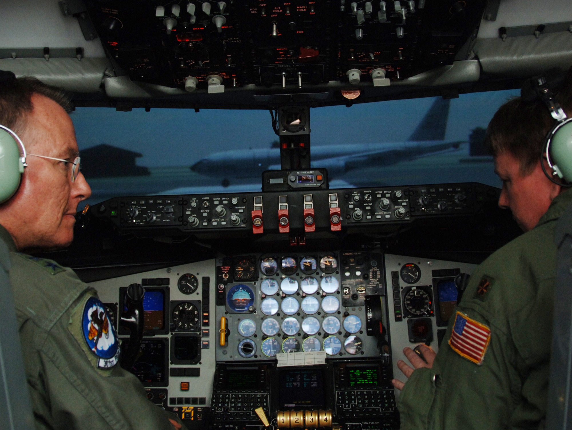 Lt. Gen. John Bradley, Commander, Air Force Reserve Command and Chief, Air Force Reserve, gets instruction from Maj. Mike Gibbons before flying inside a KC-135 flight simulator at McConnell Air Force Base, Kan., on May 8.  Major Gibbons is a pilot for the 18th Air Refueling Squadron, the flying squadron of the 931st Air Refueling Group. (U.S. Air Force photo/Tech. Sgt. Jason Schaap)