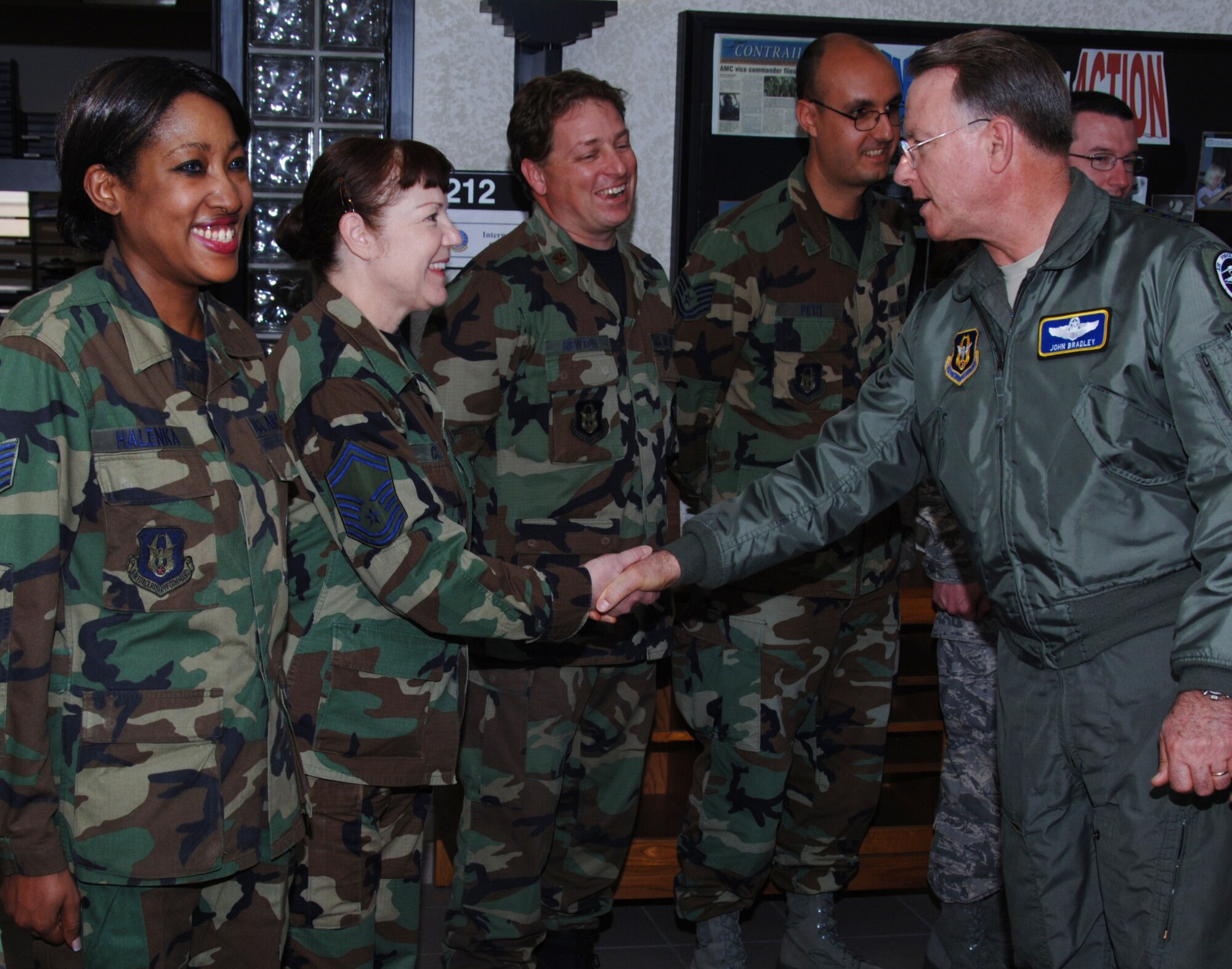 Senior Master Sgt. Colleen Celeski receives a coin from Lt. Gen. John Bradley, Commander, Air Force Reserve Command and Chief, Air Force Reserve, just prior to a town hall meeting at McConnell Air Force Base, Kan., on May 8.  General Bradley traveled to McConnell to visit members of the 931st Air Refueling Group.  Sergeant Celeski is a member of the 931st Aerospace Medicine Flight. (U.S. Air Force photo/Tech Sgt. Jason Schaap)