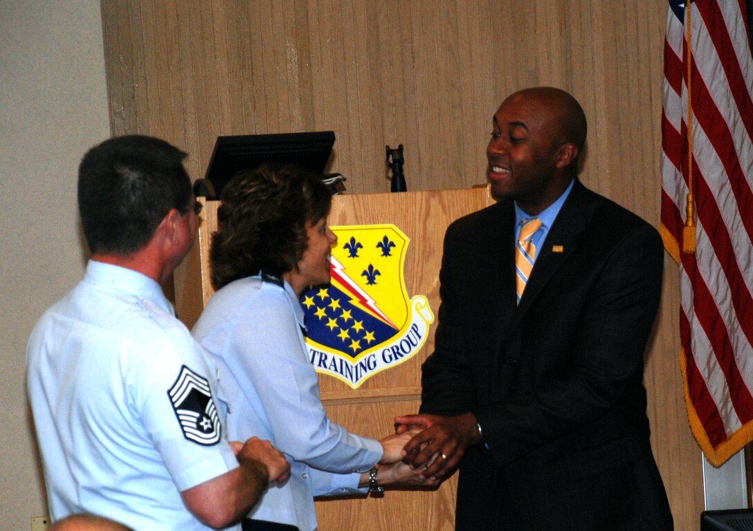 Chief Master Sergeant Michael Crowley, the project officer for the 882nd Training 
Group, and Col. Nancy Dezell, the group commander, greets Marcel Johnson, the 
vice president of economic development for the San Antonio Chamber of Commerce, 
at a meeting May 6. The San Antonio Chamber of Commerce visited Sheppard to discuss the 882nd TRG's transition to San Antonio. (U.S. Air Force photo/ Airman 1st Class Candy Miller)