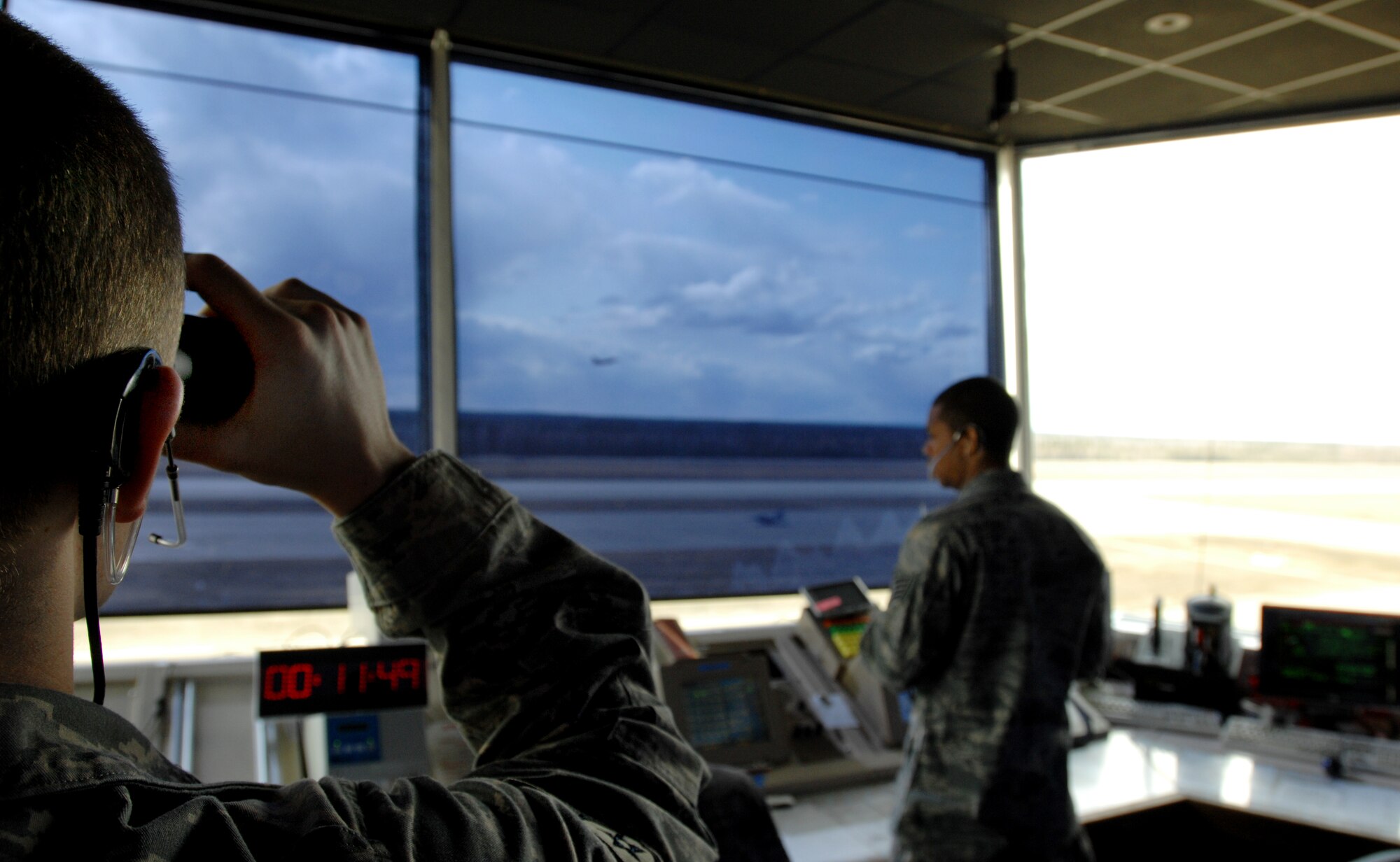 Staff Sgt. Michael Lantz, an air traffic control journeyman assigned to the 354th Operations Support Squadron Eielson AFB, Alaska, uses a set of binoculars to monitor aircraft taking off and taxiing at Eielson Air Force Base, Alaska May 7, 2008.  Air traffic controllers clear all airspace prior to aircraft taking off, transitioning into Eielson AFB airspace, and landing to ensure all aircraft launch, fly, and land safely.

(U.S Air Force Photo by Tech. Sgt Eric T. Sheler)
