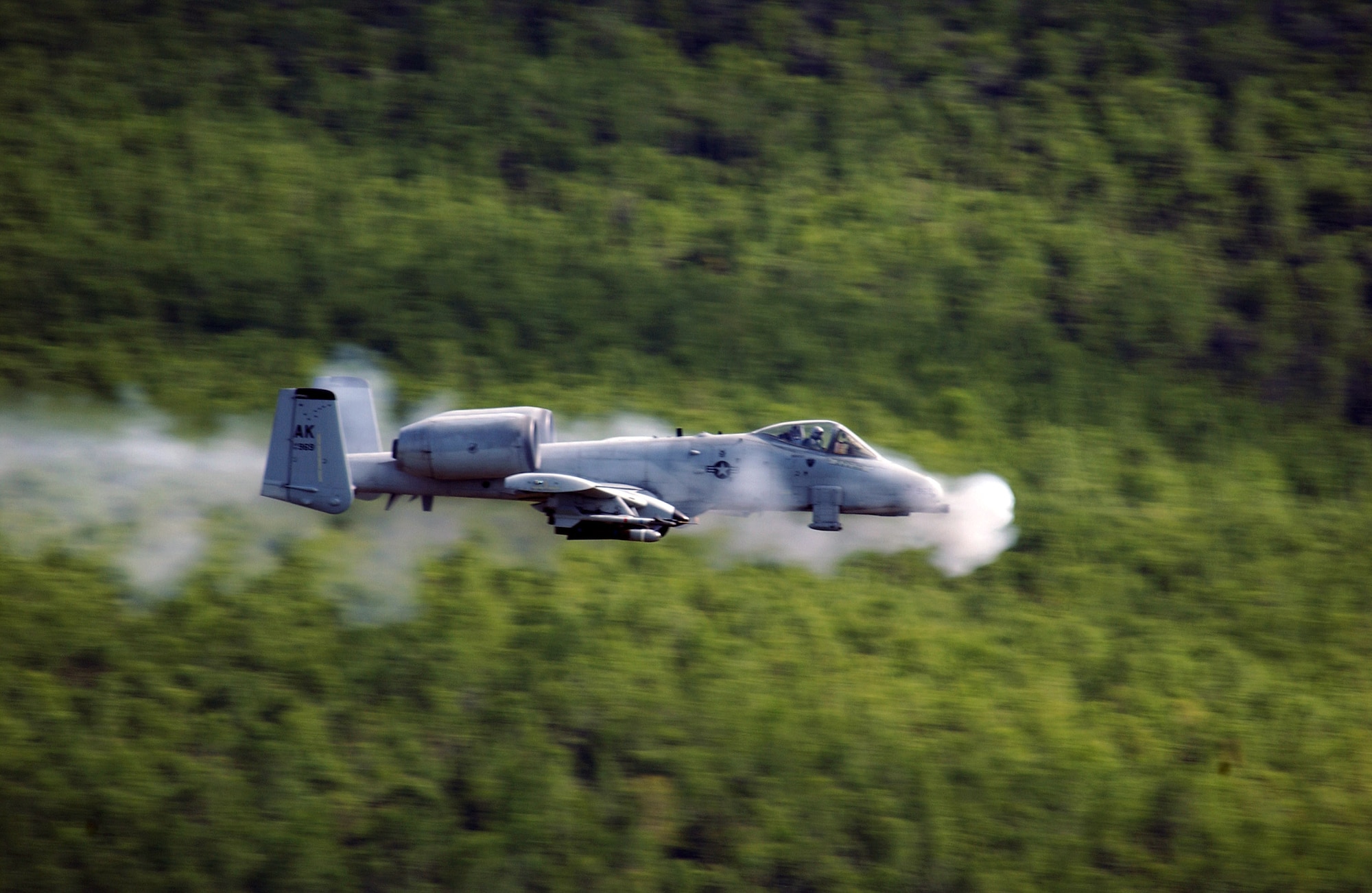 An A-10 Thunderbolt II from the 355th Fighter Squadron at Eielson Air Force Base, Alaska, fires a 30mm GAU-8 Avenger seven-barrel Gatling gun over the Pacific Alaska Range Complex.  (U.S. Air Force photo/Airman 1st Class Jonathan Snyder)