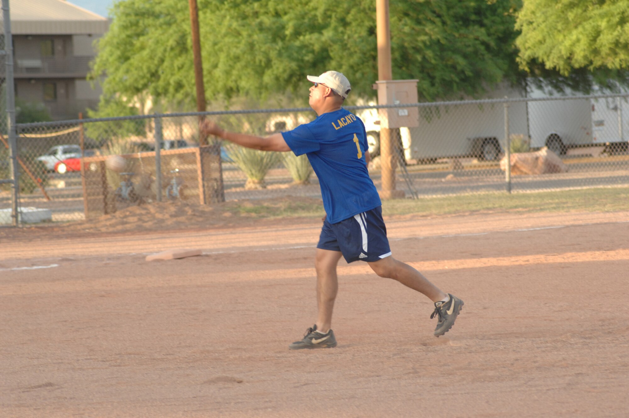 The pitcher from OWS throws a pitch to a member of the Med Group  in a 33-10 Med Group victory of a D-M intramural softball leage game May 8. (U.S. Air Force photo by Senior Airman Alesia Goosic)