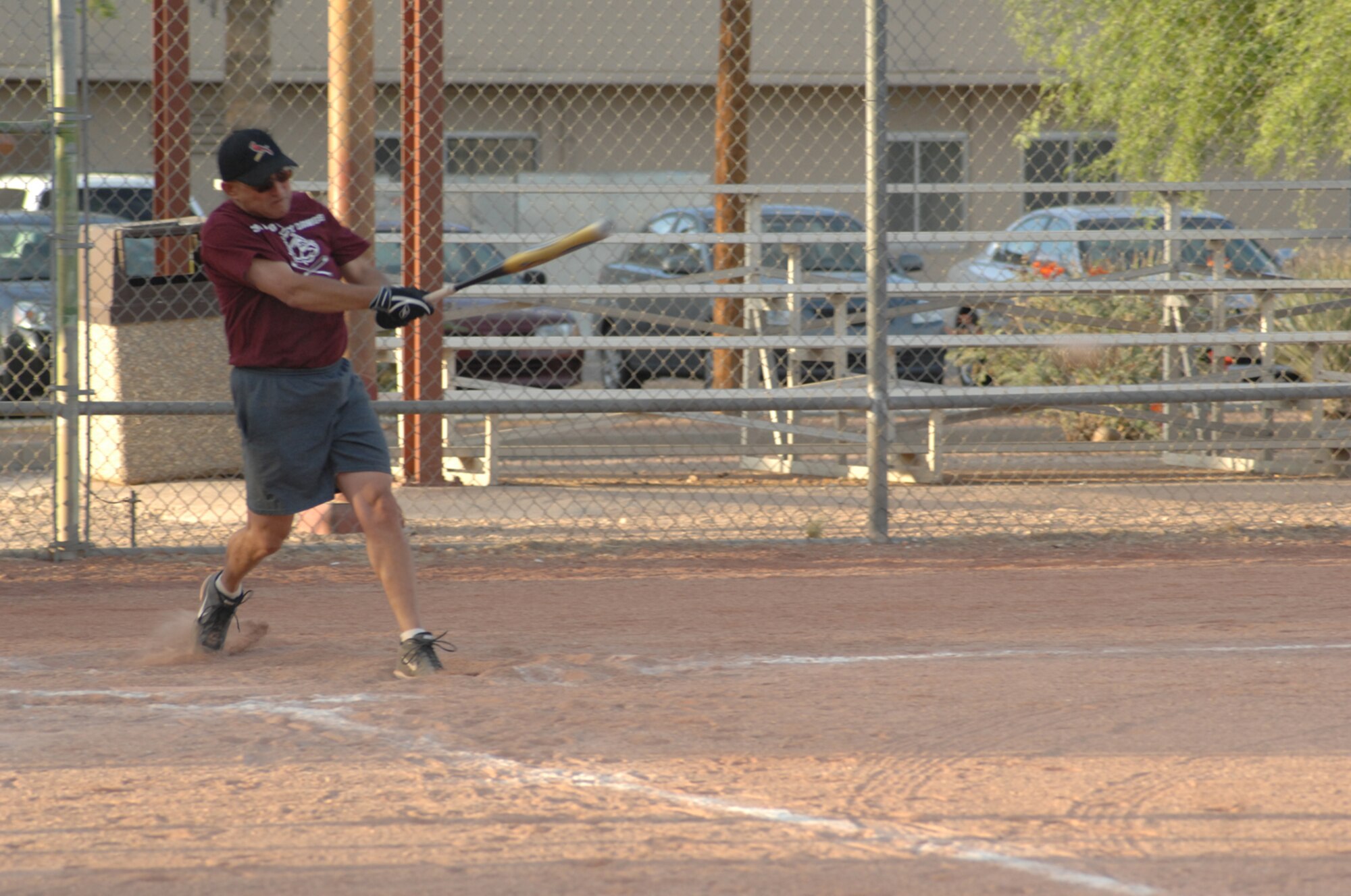 A member of the Med Groupgets a base hit in a 33-10 Med Group victory of a D-M intramural softball leage game May 8. (U.S. Air Force photo by Senior Airman Alesia Goosic)