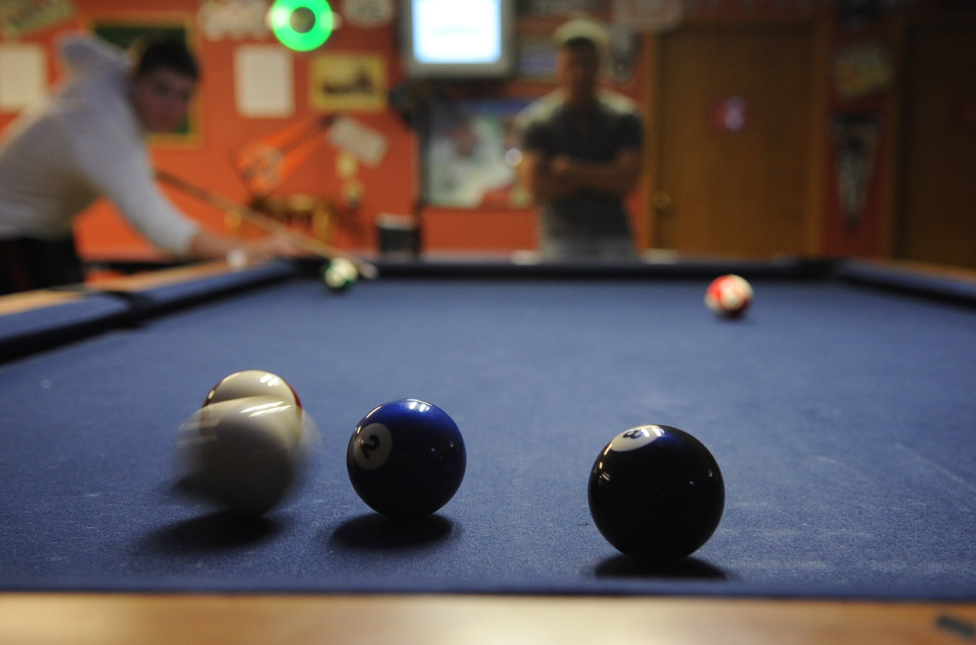 Airman Scott Ross, 28th Medical Group aerospace medical technician, shoots a bank shot, but misses his target during the first Airmen Billiards Tournament at the Black Hills Community Center, May 7.  The tournament began May 7 and will run through June 25; finals begin June 28. (U.S. Air Force photo/Senior Airman Anthony Sanchelli)
