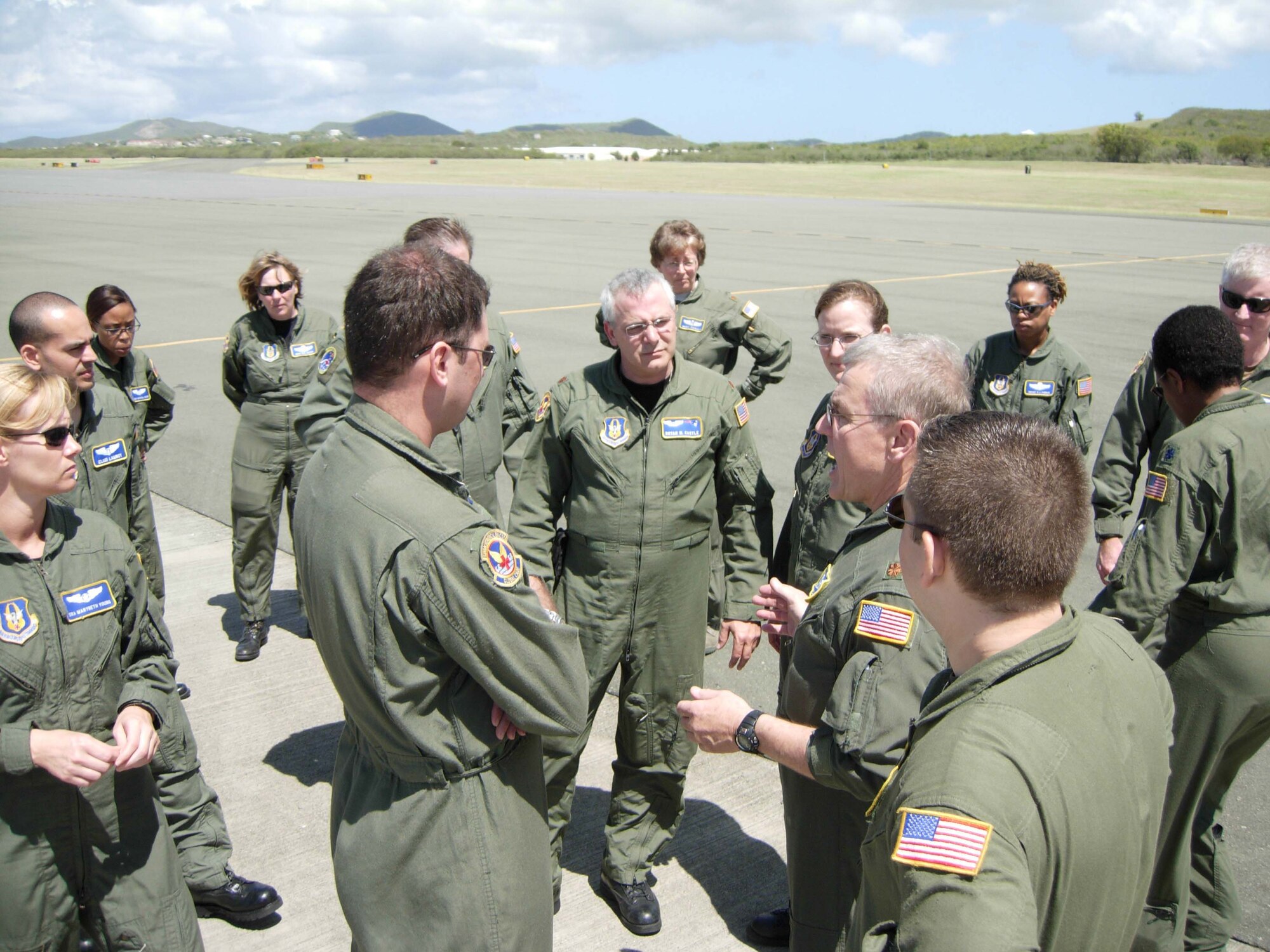 ST. CROIX, U.S. VIRGIN ISLANDS -- Members of the 439th Aeromedical Evacuation Squadron and the 459th Aeromedical Evacuation Squadron gather to review their demonstrated emergency evacuation of a KC-135 Stratotanker following a simulated in-flight emergency. Ten members of the 439th AES joined more than a dozen 459th AES members in a blended AE training mission to the island. Mission training expanded beyond the medical realm to include air refueling and an overseas sortie. (U.S. Air Force photo/Staff Sgt. Amaani Lyle)