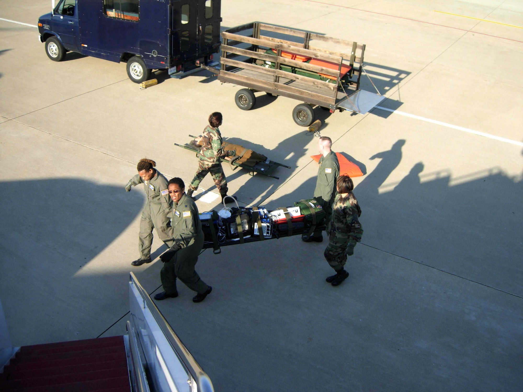 ANDREWS AIR FORCE BASE, Md. -- Members of the 459th Aeromedical Evacuation Squadron load litters of medical equipment in preparation for their training flight to St. Croix, U.S. Virgin Islands April 18. Ten members of the 439th AES joined 459th AES members in a blended training mission to the island. Mission training expanded beyond the medical realm to include air refueling and an overseas sortie. (U.S. Air Force photo/Staff Sgt. Amaani Lyle)