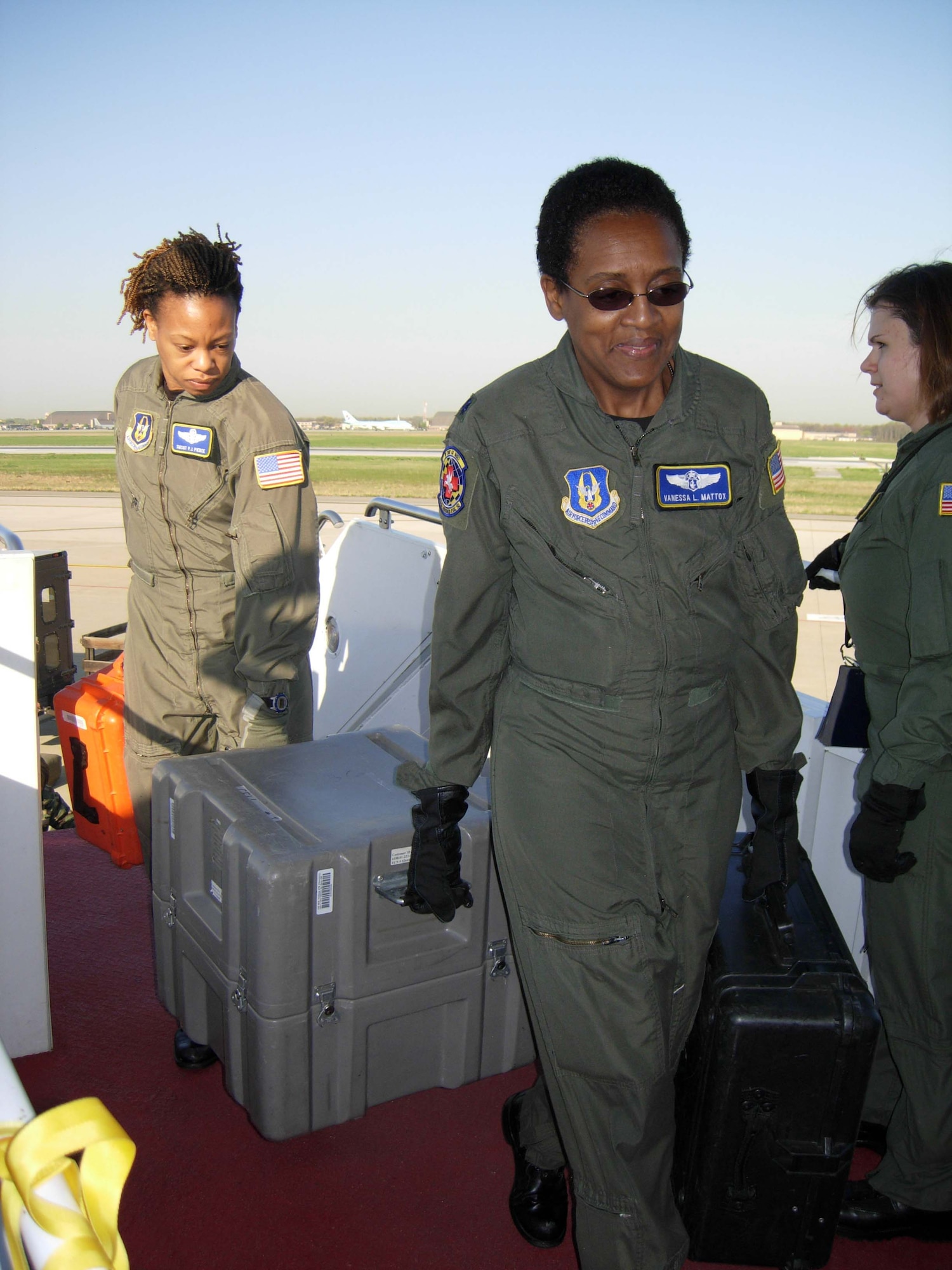ANDREWS AIR FORCE BASE, Md. -- Senior Master Sgt. P.J. Pierce, 459th Aeromedical Evacuation Squadron medical technician, Lt. Col. Vanessa Mattox, 459th AES commander, and Tech. Sgt. Crystal Drake, 459th AES medical technician, load medical equipment aboard a KC-135 Stratotanker prior to take off for an in-flight exercise. Ten members of the 439th AES joined 459th AES members in a blended AE training mission to the island. Mission training expanded beyond the medical realm to include air refueling and an overseas sortie. (U.S. Air Force photo/Staff Sgt. Amaani Lyle)