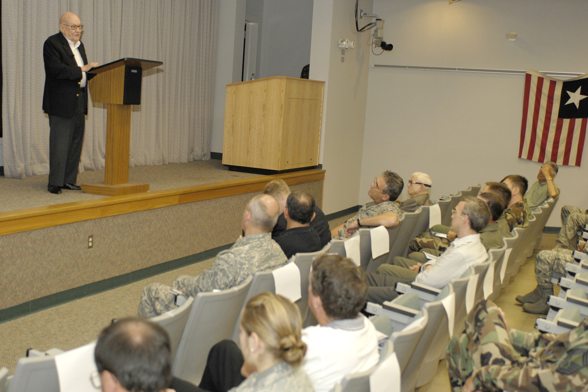 Retired Air Force Maj. Gen. John Alison, deputy commander of the 1st Air Commando Group in 1943, recounts for an audience gathered at the U.S. Air Force Special Operations School at Hurlburt Field May 6, his experiences standing up the outfit in the China-Burma-India theater during World War II. Alongside the British commandos, called the ?Chindits,? the 1st ACG executed Operation Thursday on March 5, 1943, penetrating deep behind Japanese lines and conducting the first nighttime airfield seizure. (U.S. Air Force photo/Airman 1st Class Jason Epley)
