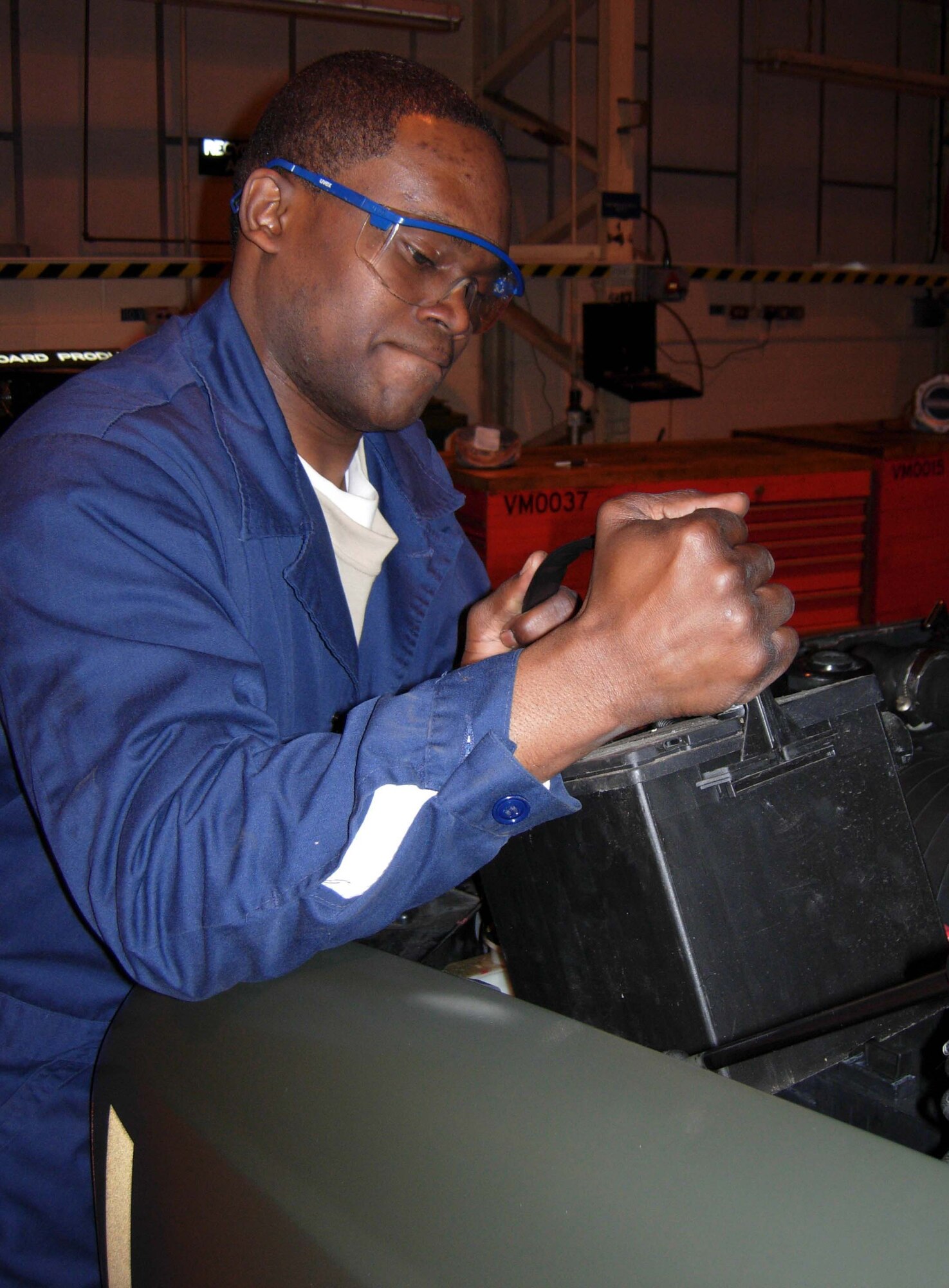 RAF MILDENHALL, England -- Senior Airman Marlon Yarde, 459th Logistics Readiness Squadron vehicle and equipment maintenance journeyman, removes the battery from a Ford Bobtail towing truck during annual tour in support of U.S. Air Forces in Europe taskings April 14. Thirty-one members of the 459th Logistics Readiness Flight, 459th Communications Flight, 459th Mission Support Group and the 69th Aerial Port Squadron spent their annual tour here to support U.S. Air Forces in Europe taskings for the rural area mission, about 80 miles outside of London. (U.S. Air Force photo/Staff Sgt. Amaani Lyle)
