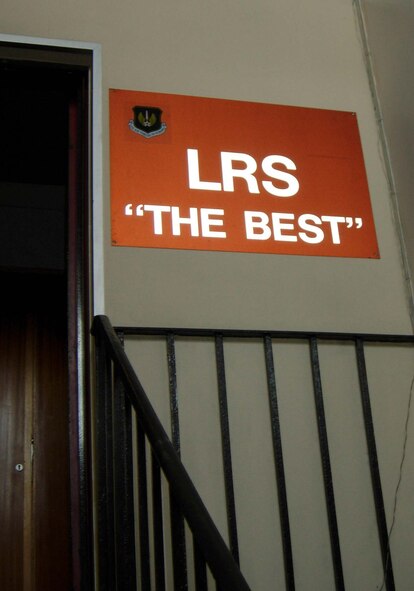 RAF MILDENHALL, England -- A 100th Logistics Readiness Squadron sign hangs in the customer service building here April 14. Thirty-one members of the 459th Logistics Readiness Flight, 459th Communications Flight, 459th Mission Support Group and the 69th Aerial Port Squadron spent their annual tour here to support U.S. Air Forces in Europe taskings for the rural area mission, about 80 miles outside of London. (U.S. Air Force photo/Staff Sgt. Amaani Lyle)