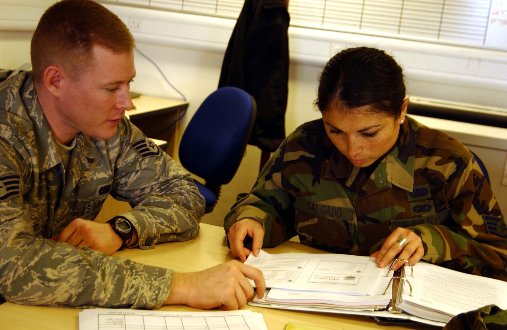 RAF MILDENHALL, England -- Staff Sgt. Andrew Wright, 100th Logistics Readiness Squadron logistics planner and Tech. Sgt. Marisol Salgado, 459th Logistics Readiness Flight logistics planner, discuss online training record updating during the 459th LRF's annual tour here April 14. Thirty-one members of the 459th Logistics Readiness Flight, 459th Communications Flight, 459th Mission Support Group and the 69th Aerial Port Squadron spent their annual tour here to support U.S. Air Forces in Europe taskings for the rural area mission, about 80 miles outside of London. (U.S. Air Force photo/Staff Sgt. Amaani Lyle)