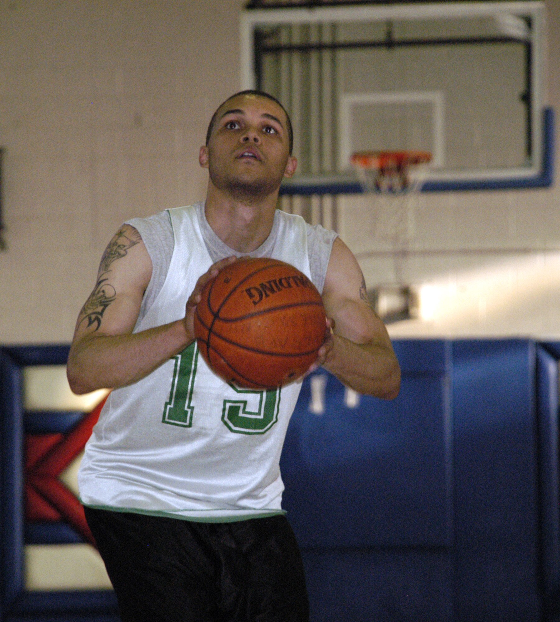 Justin Plummer, 436th MXS, keeps his eyes on the prize, as he prepares to shoot a free throw. (U.S. Air Force photos/Airman 1st Class Shen-Chia Chu)
