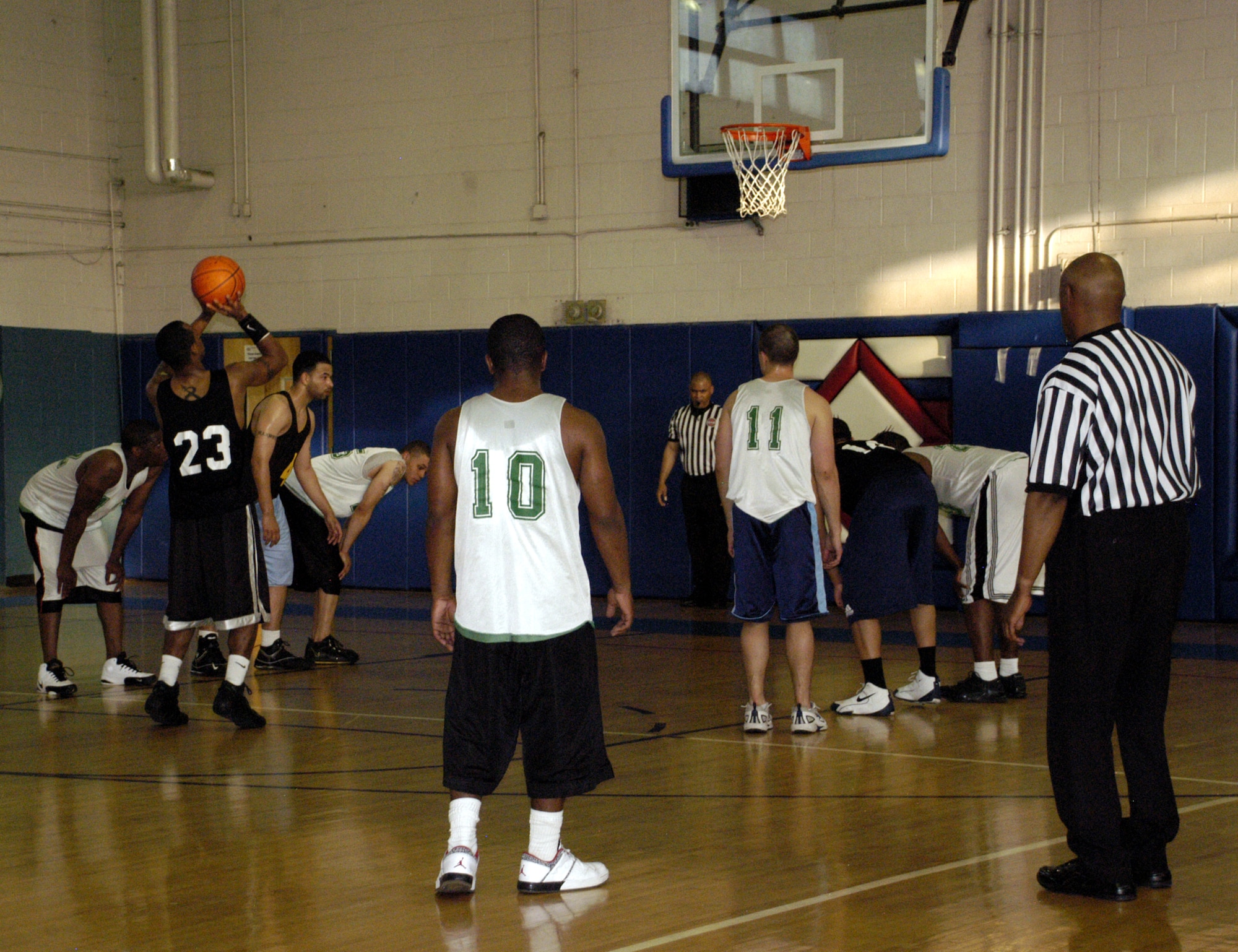 Jerome Jenkins, 512th MSS team (black), shoots a free throw during the first half of the game. (U.S. Air Force photos/Airman 1st Class Shen-Chia Chu)