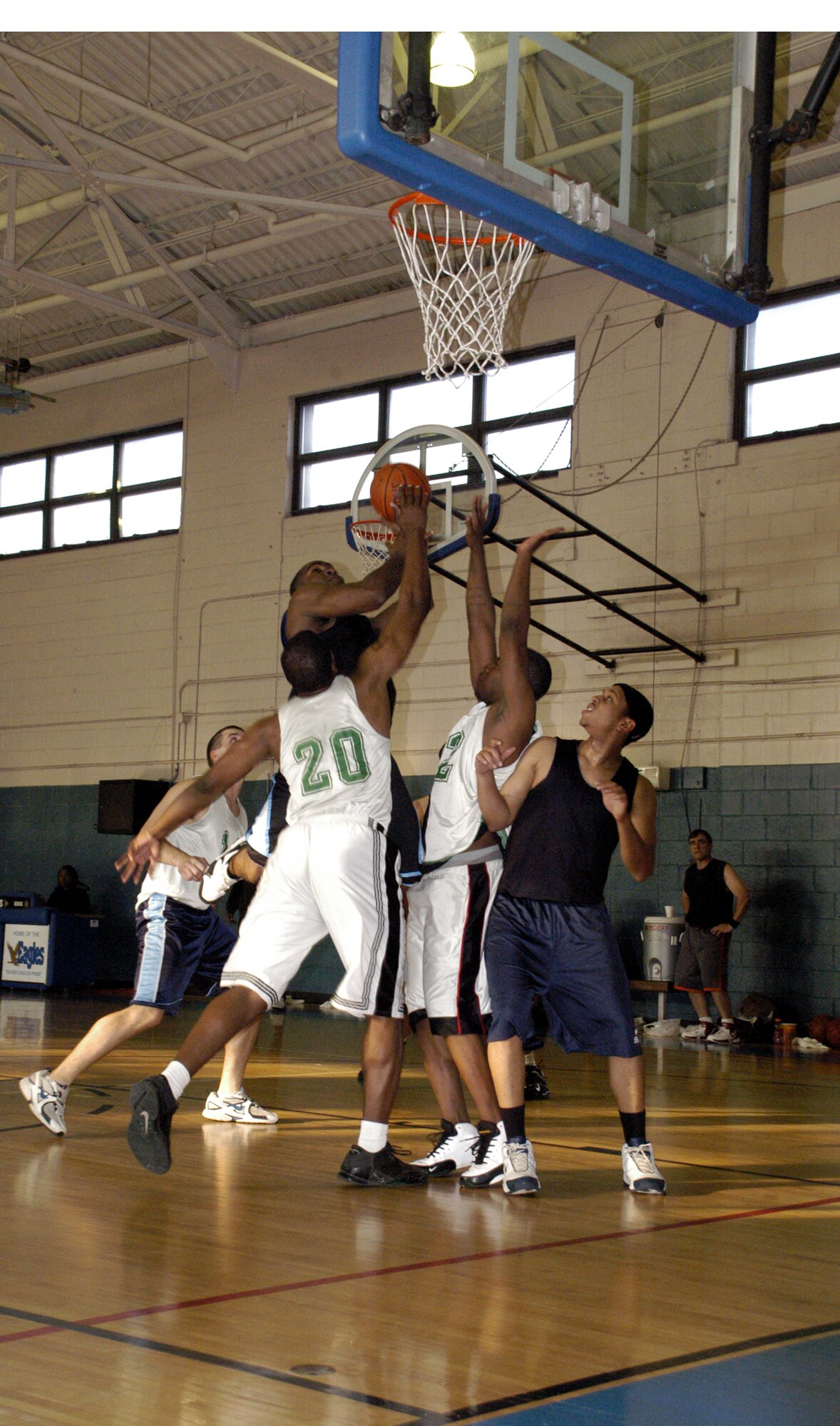 A group of Maintainers battle for the ball as the 512th MSS (black) tries to shoot for a two-pointer. (U.S. Air Force photos/Airman 1st Class Shen-Chia Chu)