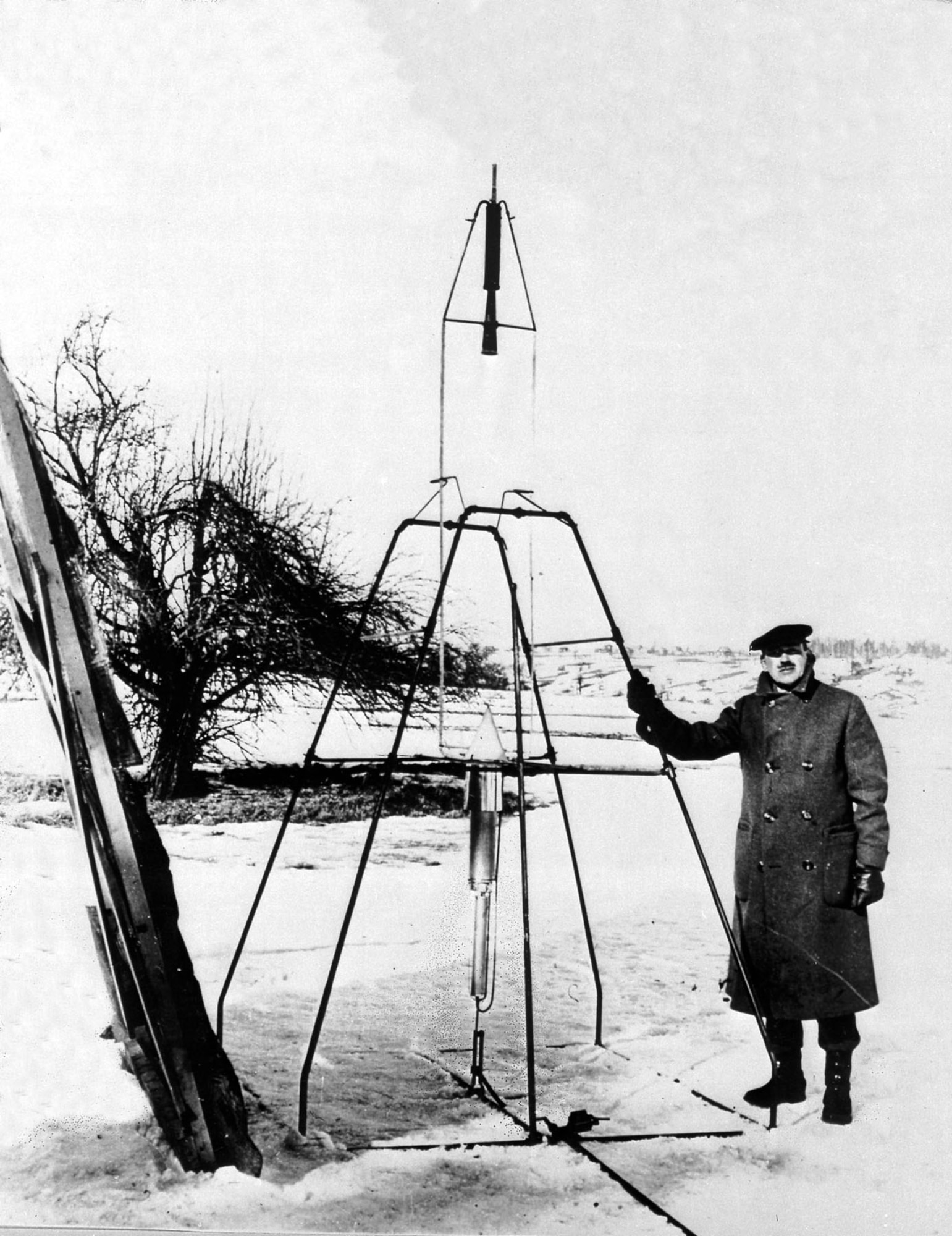 Goddard with the same 1926 rocket in its launch frame, Worcester, Mass. (U.S. Air Force photo)