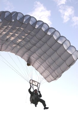 A jumper from the Royal Thai Air Force heads toward the point of impact at Lukpad drop zone near Udon Thani, Thailand.  Jumpers from the RTAF and the 353d Special Operations Group from Kadena Air Base, Japan, are participating in Exercise Teak Torch, a joint combined exercise training event.   (U.S. Air Force photo/Master Sgt. Marilyn C. Holliday)