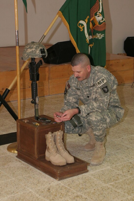 Army Lt. Col. Daryl Johnson, commanding officer, 504th MP Bn., which is attached to Regimental Combat Team 5, remembers Army Pfc. Aaron Ward during a memorial service at the chapel on Al Asad Air Base, Iraq, Friday.  Ward, 19, a military policeman with 170th Military Police Company, 504th MP Bn., was killed May 6 while on a combat patrol in western Anbar province, Iraq.  Ward, who was from Temecula, Calif., had only been in Iraq since March.