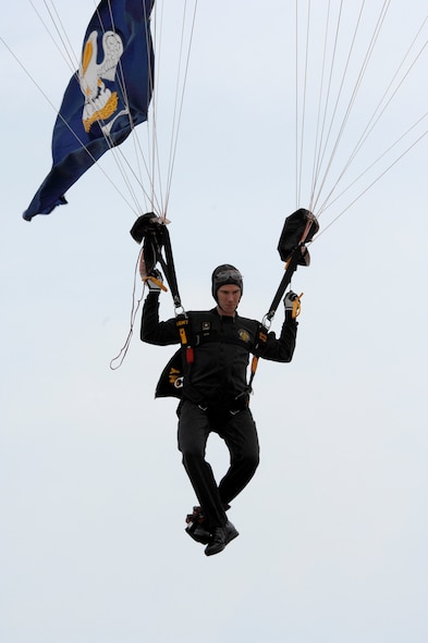 BARKSDALE AIR FORCE BASE, La. -- U.S. Army Staff Sgt. Justin Blewitt, Golden Knights Parachutist, escorts the U.S. Flag to the Barksdale Air Force Base flight line during the opening ceremony of the 2008 Defenders of Liberty Air Show.  The Air Show commemorates the 75th anniversary of Barksdale Air Force Base.  (U.S. Air Force photo by TSgt Laura K. Smith)