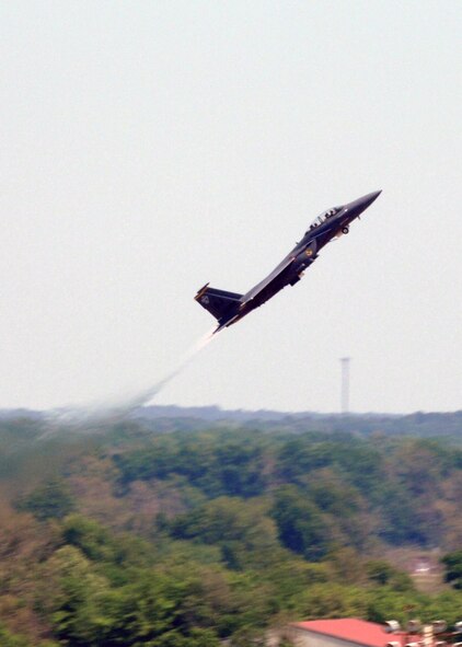 A U.S. Air Force F-15E takes off and climbs high above Air Show crowds at Barksdale Air Force Base, Louisiana, on April 21, 2007. This event was part of the Defender's of Liberty Air Show 2007 held at Barksdale this weekend. (U.S. Air Force photo by Airman 1st Class Joanna M. Kresge)