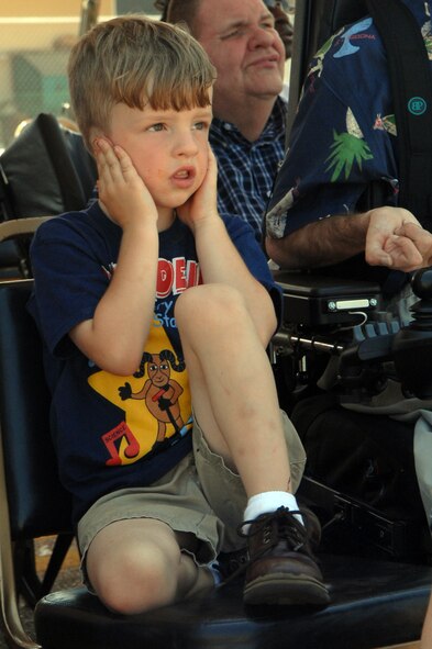 BARKSDALE AIR FORCE BASE, La. - Gage Bowman of Shreveport covers his ears as the U.S. Navy Blue Angels fly-by during the Defenders of Liberty Air Show held here May 9. (U.S. Air Force photo by Airman 1st Class Joanna M. Kresge)