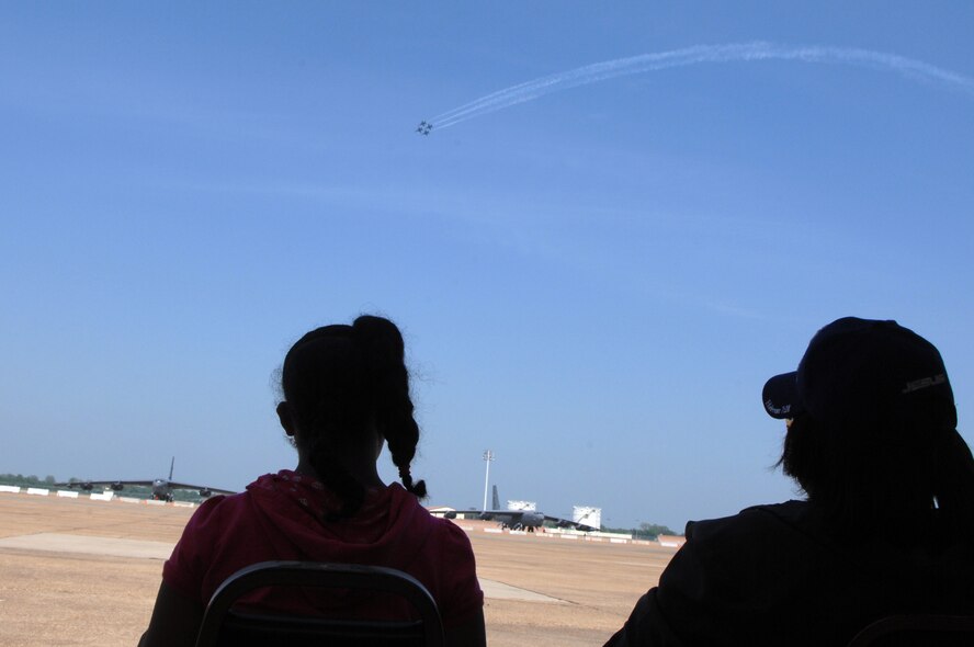 BARKSDALE AIR FORCE BASE, La. - Attendees at the Defenders of Liberty Air Show watch the U.S. Navy Blue Angels fly-by May 9. (U.S. Air Force photo by Airman 1st Class Joanna M. Kresge)