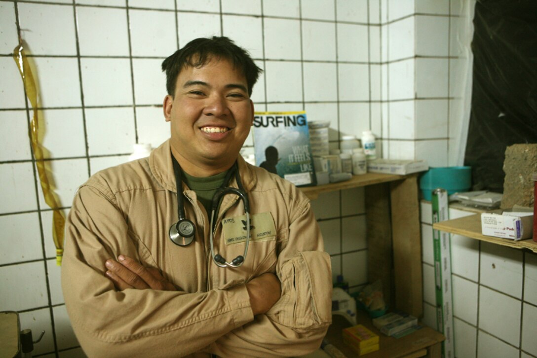Petty Officer 2nd Class Jason C. Deguzman, a corpsman with Team Mustang, 2nd Light Armored Reconnaissance Battalion, Regimental Combat Team 5, stands in his casualty treatment center at Patrol Base Rio Grande, Iraq, May 10. Although, Deguzman has received two Bronze Stars, a Purple Heart and is commonly referred to as a "war hero," he remains extremely humble.