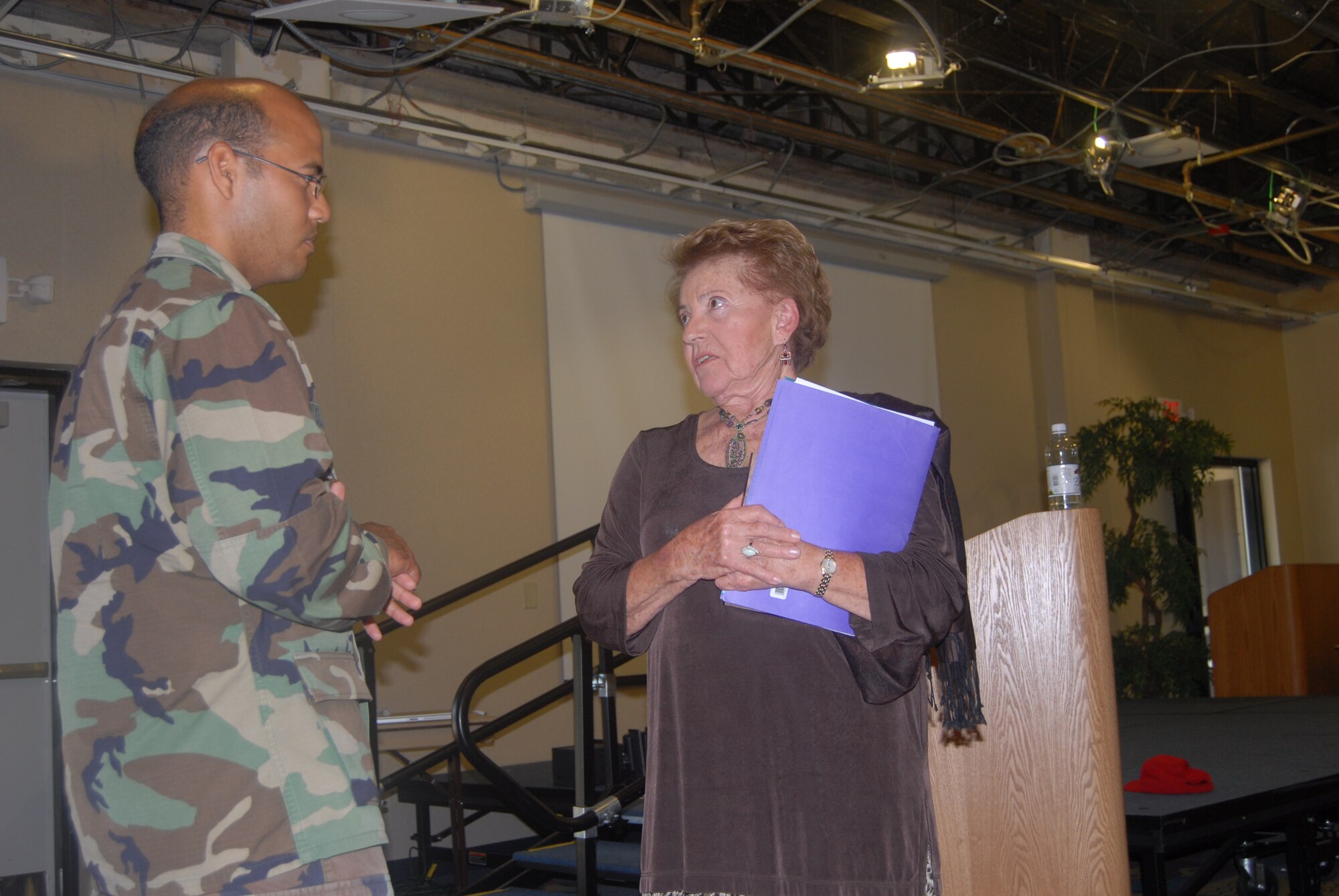 Capt. Julio Delanoy, 43rd Logistics Readiness Squadron, talks to Esther Lederman, Holocaust survivor, after hearing her speak at the Community Activities Center May 2.
(U.S. Air Force Photo by Airman 1st Class Mindy Bloem)