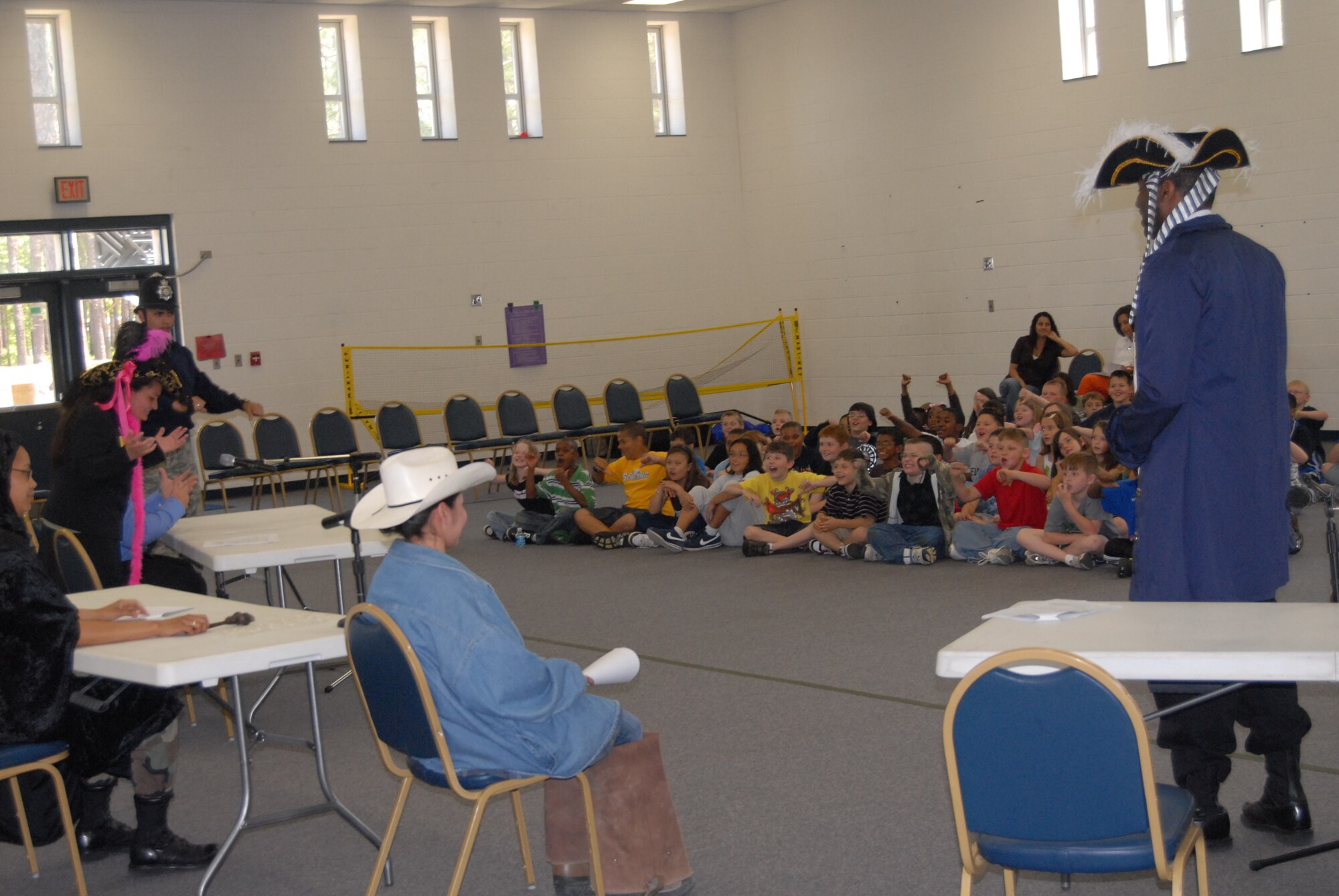 Students from Pope Elementary react during the “Big Bad Wolf versus Curly Pig” skit performed by the 43rd Airlift Wing Staff Judge Advocate's office May 1. More than 90 students from 2nd through 4th grade watched the skit, which allowed the students to serve as the jury and learn about legal preceedings. The skit included Lt. Col. Donald Eller, Master Sgt. Nancy Birchard, Staff Sgts. Crystal Ybarra, Stephen Dalmida, Richard De Le Ree and Roilana Thomas and Airman 1st Class Rebecca English. (U.S. Air Force Photo by 2nd Lt. Chris Hoyler)