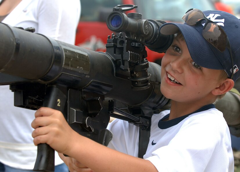 BARKSDALE AIR FORCE BASE, La -- Hal Gatti, 9, holds a display bazooka at the Marine Recruiting Center during the 2008 Defenders of Liberty Air Show here May 10. (U.S. Air Force photo by A1C Brittany Y. Bateman) 