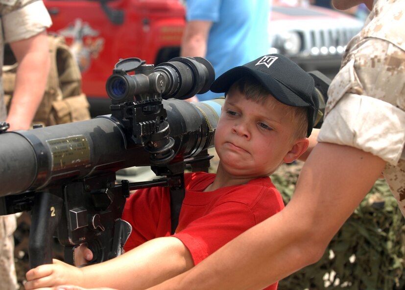 BARKSDALE AIR FORCE BASE, La -- Haydek Gatti, 7, holds a display bazooka at the Marine Recruiting Center during the 2008 Defenders of Liberty Air Show here May 10. (U.S. Air Force photo by A1C Brittany Y. Bateman) 