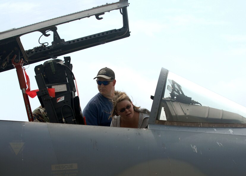 BARKSDALE AIR FORCE BASE, La -- Amanda and Mike Fricks look inside of an aircraft  on display during the 2008 Defenders of Liberty Air Show here May 10. (U.S. Air Force photo by A1C Brittany Y. Bateman) 