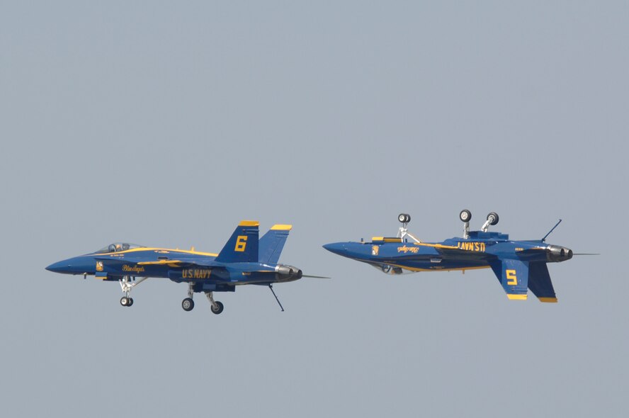BARKSDALE AIR FORCE BASE, La. -- The U.S. Navy Blue Angels perform fast-paced, high-performance maneuvers during the 2008 Defenders of Liberty Airshow here May 9. The team performs precision aerial maneuvers to exhibit the capabilities of modern high-performance aircraft to audiences around the world. Last season, more than 15 million spectators watched the Blue Angels perform. Since its inception in 1946, the Blue Angels have performed for more than 427 million fans.  (U.S. Air Force photo by Airman 1st Class Benjamin McWha)
