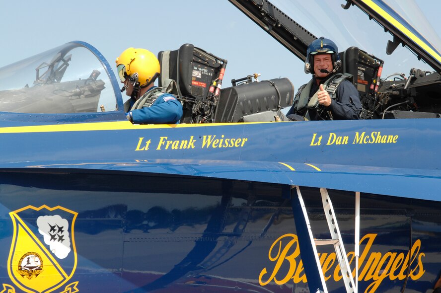 BARKSDALE AIR FORCE BASE, La. -- Dee jay “Rockin” Rick Keller (right) prepares for a media orientation flight with Blue Angel pilot Navy Lt. Frank Weisser here May 7. (U.S. Air Force photo by Airman 1st Class Benjamin McWha)