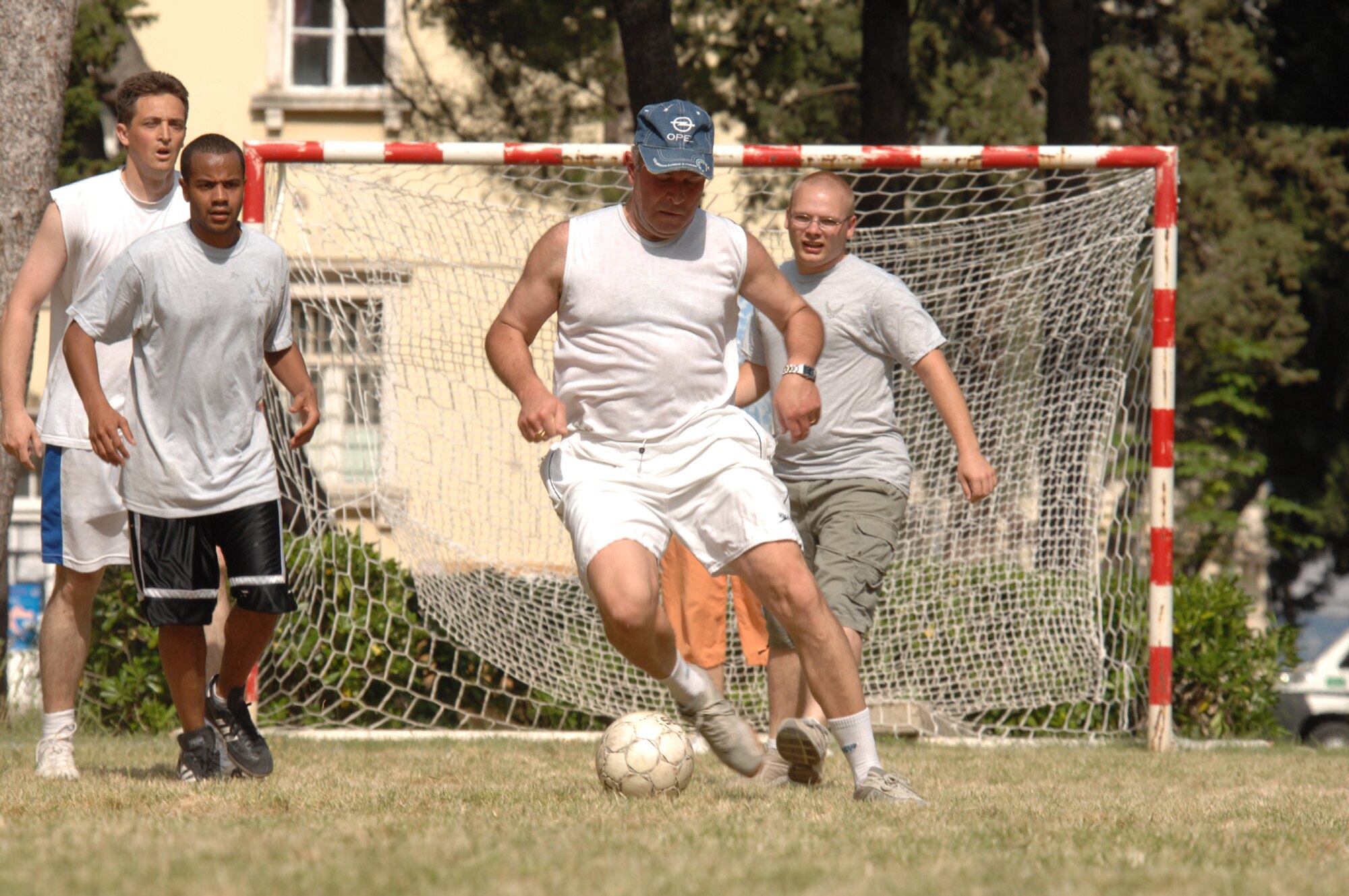 DIVULJE TRAINING BASE, Croatia – Macedonian Emil Nadjenovski charges down the field during a soccer tournament here May 8. The multi-national soccer tournament helped was designed to help 2008 Medical Training Exercise in Central and Eastern Europe (MEDCEUR) participants gain cultural insights both on and off the field. Fifteen nations are participating in the 2008 Medical Training Exercise in Central and Eastern Europe from May 2 through 14. The exercise focuses on mass-casualty training scenarios and humanitarian aid in response to crises situations. MEDCEUR is a Joint Chiefs of Staff regional/multilateral exercise sponsored by U.S. European Command. Croatia is hosting the 2008 exercise which has drawn about 400 multi-nationals in support of the Partnership for Peace initiative. (U.S. Air Force photo/Staff Sgt. Kristin Ruleau)