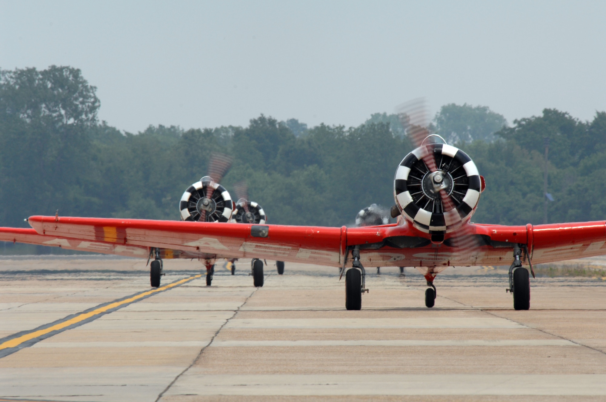 BARKSDALE AIR FORCEC BASE, La. -- Members of the Aeroshell performance team taxi off the runway during the Defenders of Liberty Air Show held here May 10. This event marks the 75th Anniversary of the base. (U.S. Air Force photo by Airman 1st Class Joanna M. Kresge)