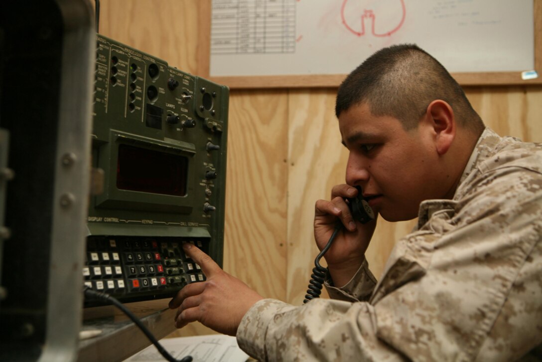 Cpl. Robert Silva, 24, a wireman with 3rd Battalion, 4th Marine Regiment, Regimental Combat Team 5, from Los Angeles, transfers a phone call using a switchboard at Combat Outpost Haditha, Iraq, May 9.  Data Marines have been doing everything they can to keep the lines of communication up and running for their battalion. Data Marines are responsible for ensuring that internet connections and phone connections are always working.