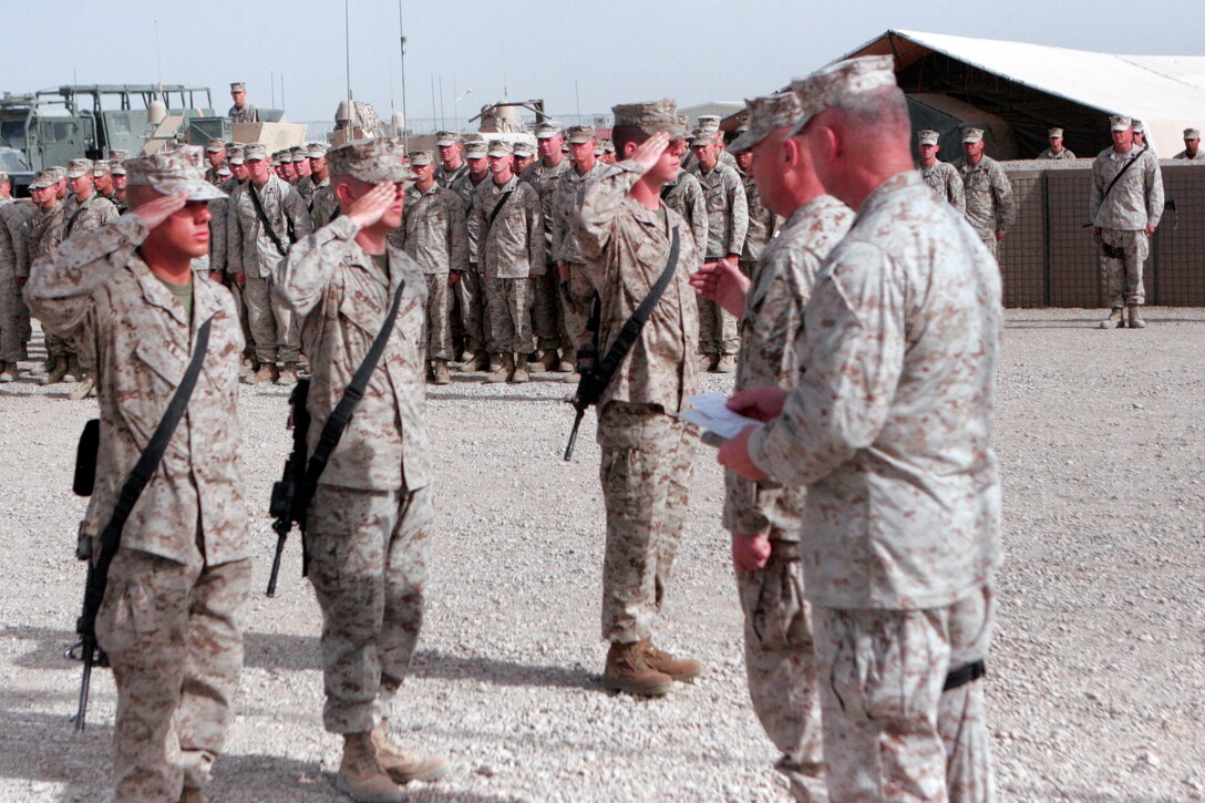 Marines of 2nd Battalion, 7th Marines, on May 14, are promoted during a camp dedication aboard Camp Bastion in the Helmand Province of Afghanistan.