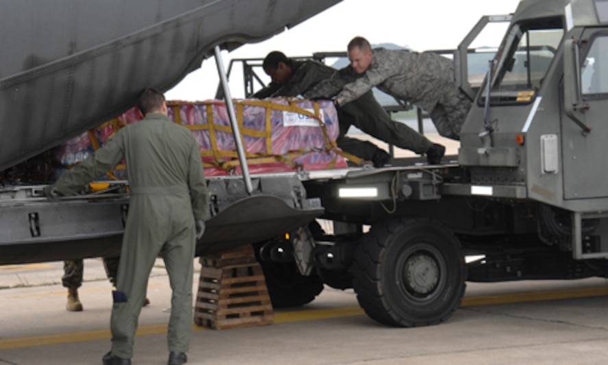 UTAPAO, Thailand - Master Sgt Todd Kneisly, 36th Mission Response Squadron, and Airman 1st Class Robert Gore, 36th Airlift Squadron, Yokota Air Base, Japan, load a C-130 Hercules with humanitarian relief supplies for victims of Burma who experienced one of the regions deadliest cyclones, Cyclone Nargis.  As of May 12, more than  $3 million in USAID, and humanitarian assistances has been provided to Burma since the catastrophic destruction on May 2. (USAF Photo/Senior Airman Sonya Croston)